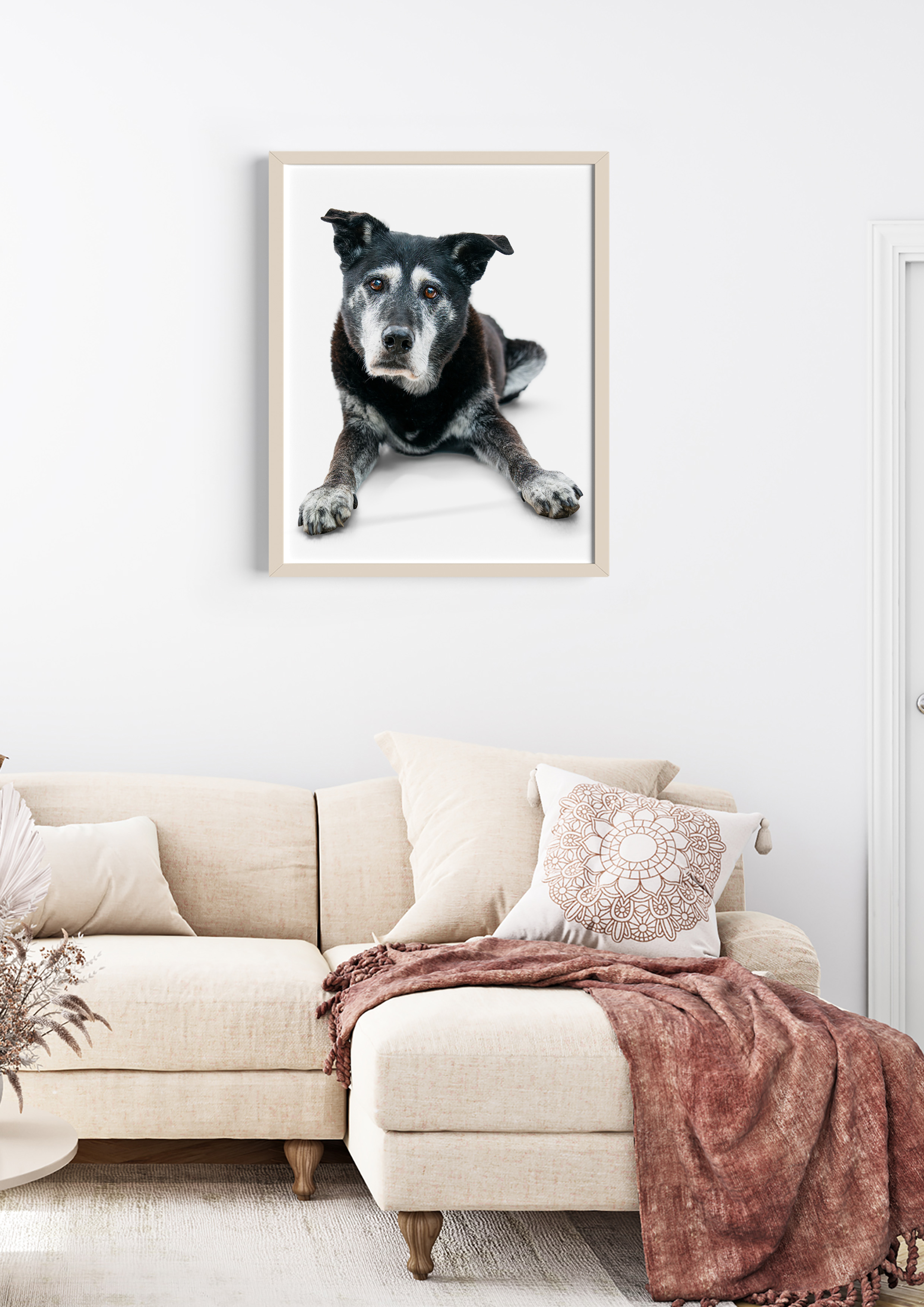 A Boop Photo dog portrait displayed above a living room sofa